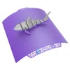 Official BIQU Panda CryoGrip Pro Glacier Purple build plate flexed with an articulated shark print, demonstrating print removal on white background, 1000 × 1000 pixels.