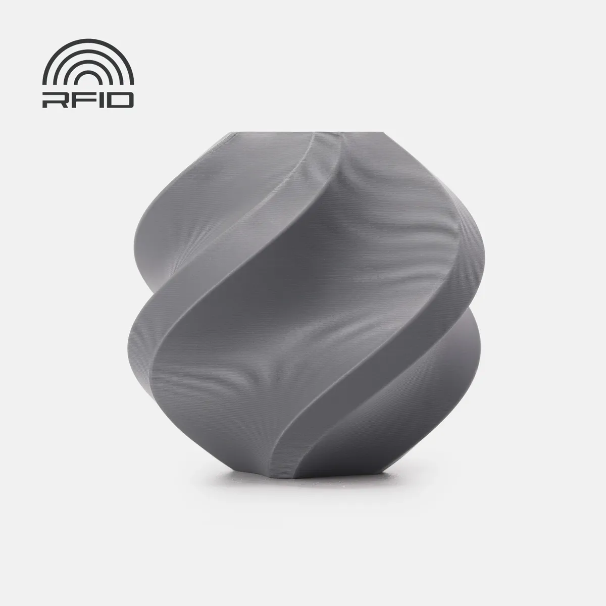 Bambu Lab PETG Matte Gray (35102), 1 kg variant: gray printed spiral vase on a neutral background with RFID graphic. Best verified gray-specific image; depicts a print sample, not the filament spool.