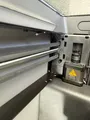 Bambu Lab P2S filament cutter stopper installed inside the printer chamber; in-use placement context.