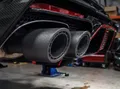 ELEGOO PET-CF automotive context image showing carbon-fiber printed exhaust-tip components.