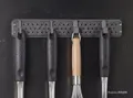 ELEGOO PET-CF application image showing a carbon-fiber printed wall-mounted kitchen utensil rack in a humid environment.
