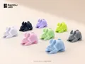 Official Bambu Lab PETG Matte printed bunny color examples, including avocado green at center, on a neutral beige background; manufacturer branding and model attribution; 1920 x 1440.
