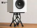 Official Bambu Lab PETG Matte application image showing a black printed speaker stand in use; includes manufacturer branding and model attribution.